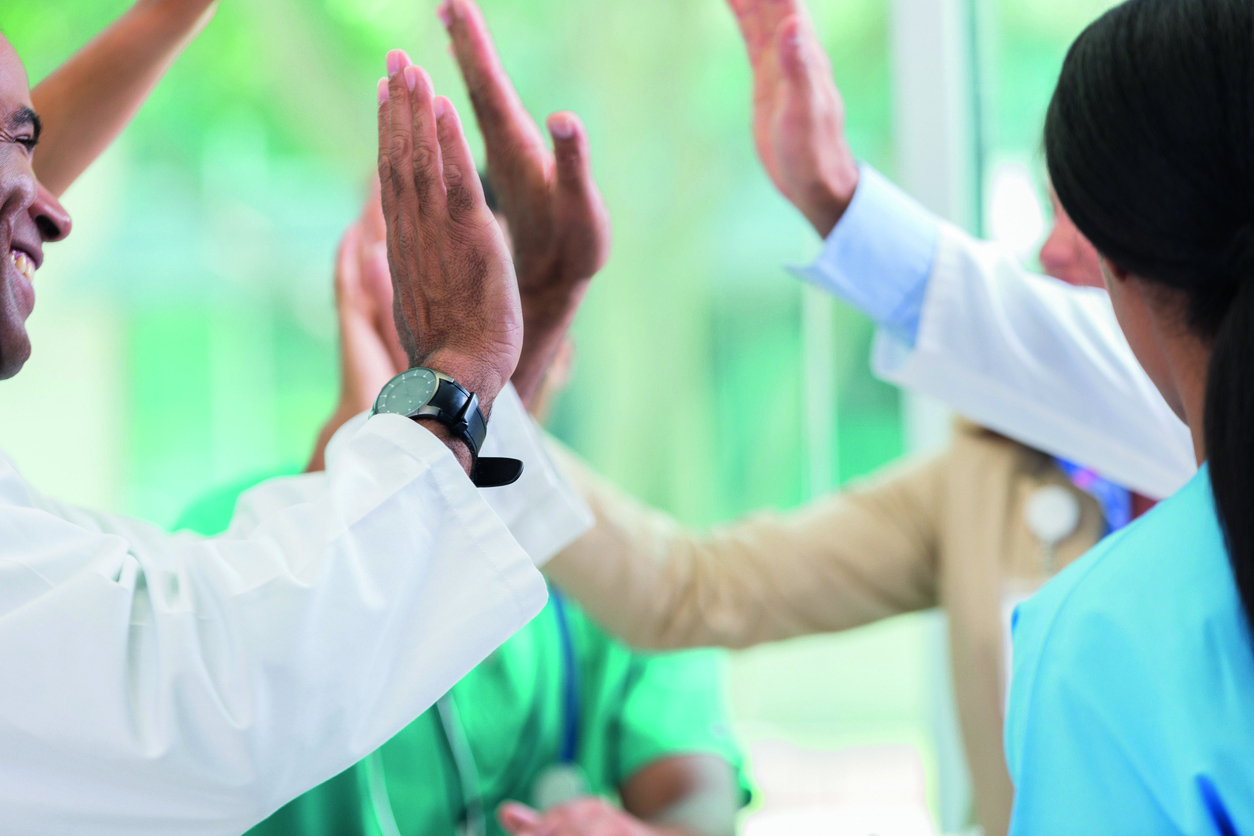 Medical professionals give high fives